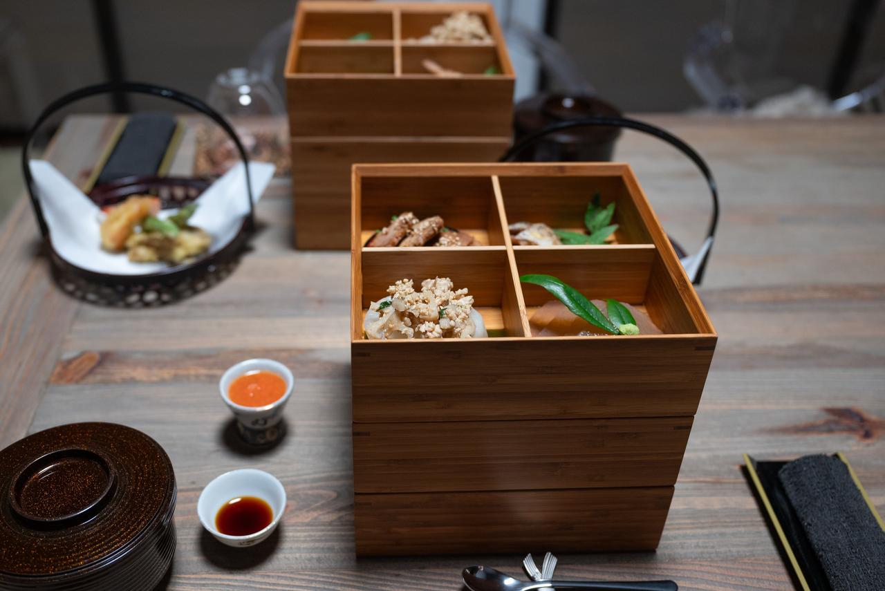 The three-tiered boxes symbolize stacking up happiness.