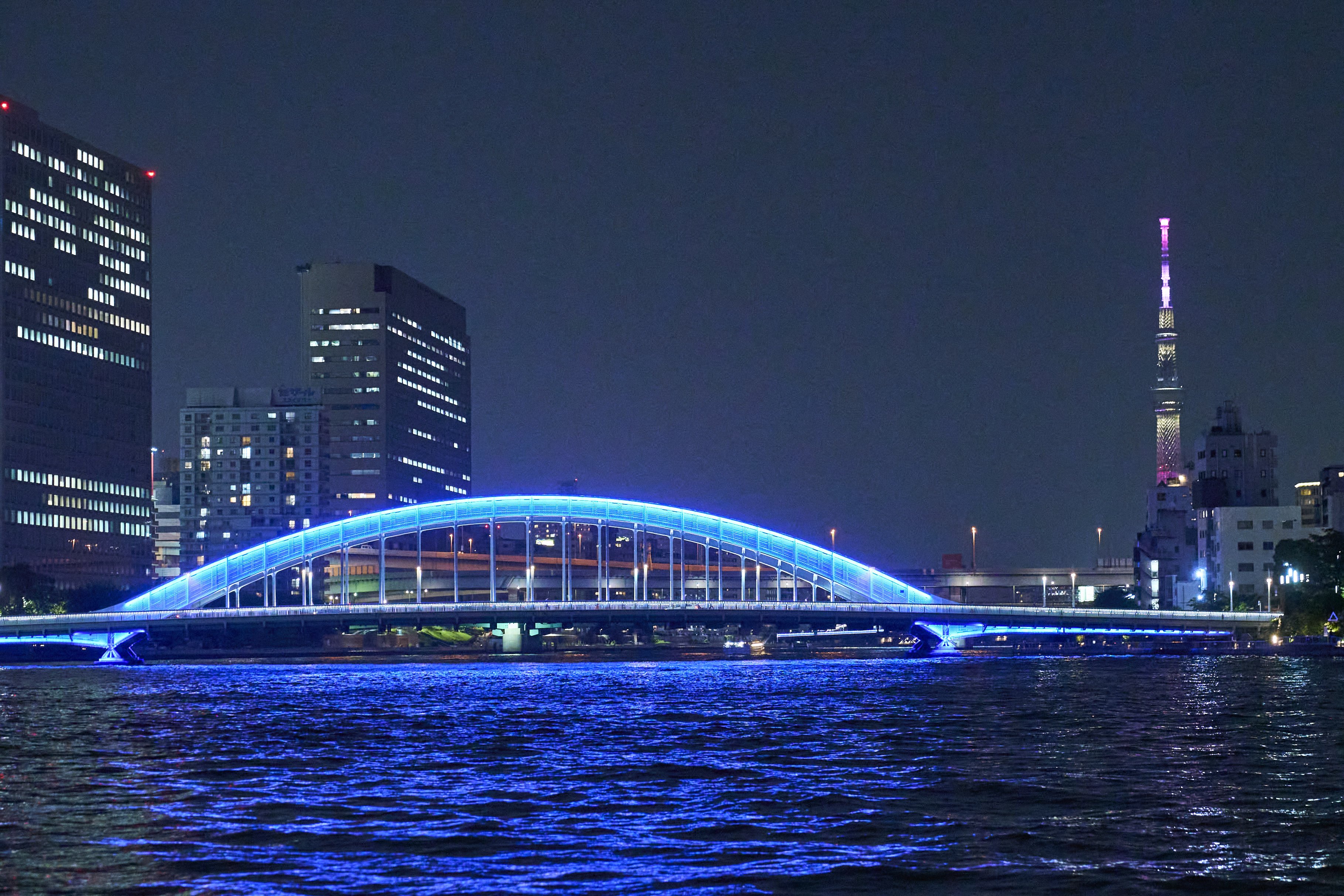 Eitai Bridge is lit up in blue.