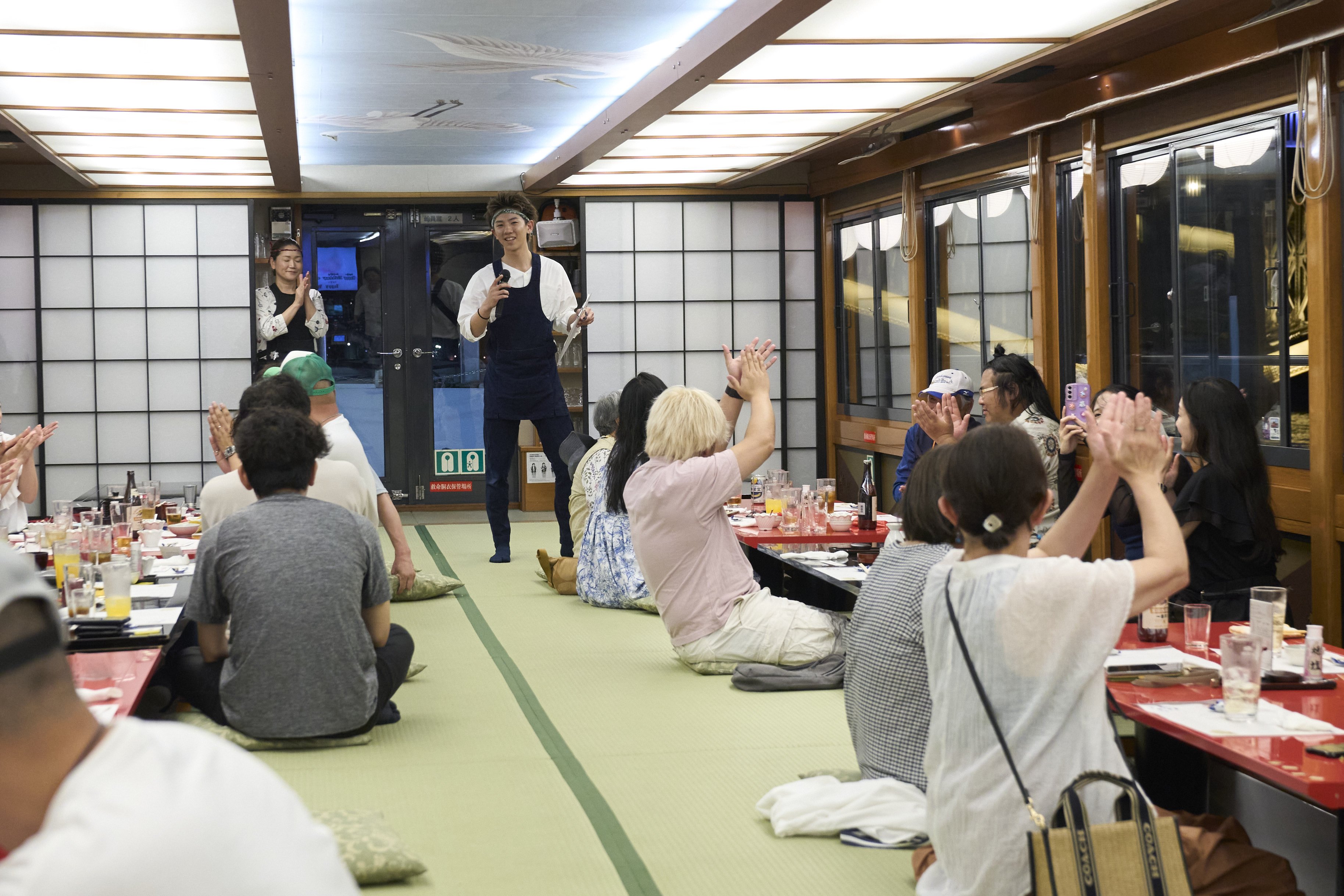 Passengers spend a moment celebrating a birthday all together.