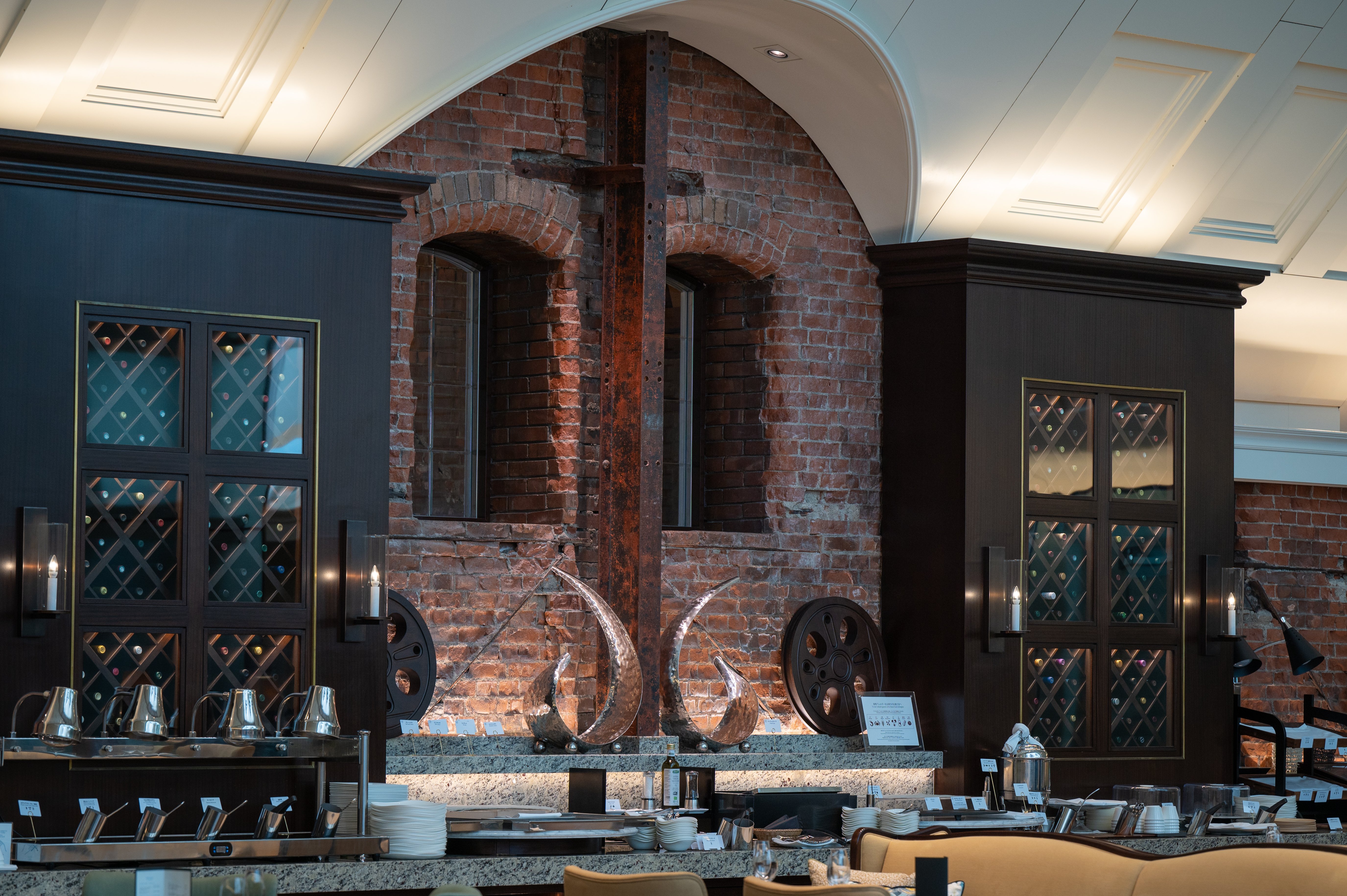 Guests in The Atrium can appreciate red brick material from the original building in the wall.