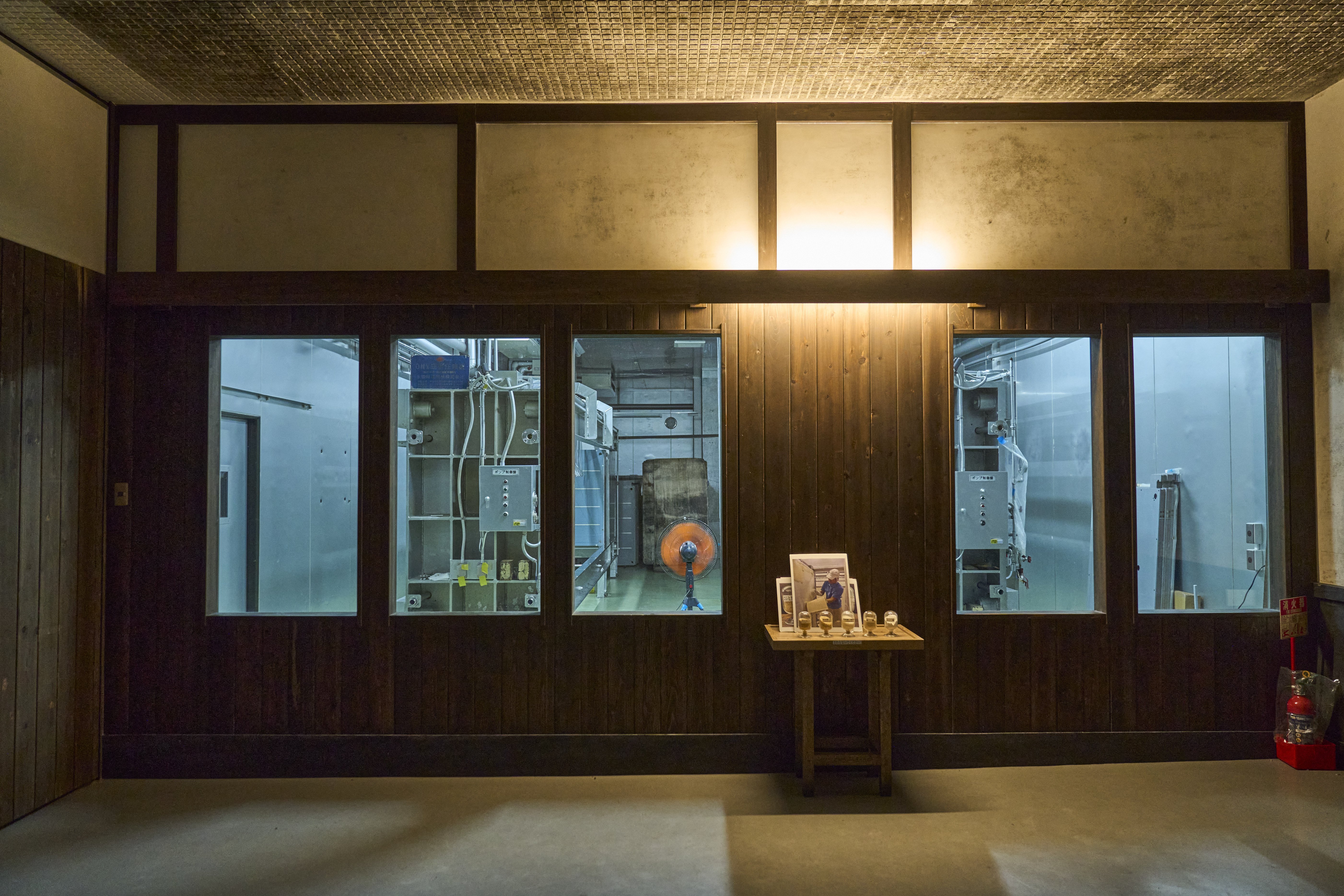 Part of the sake brewing process can be observed through glass windows in Heisei-gura.