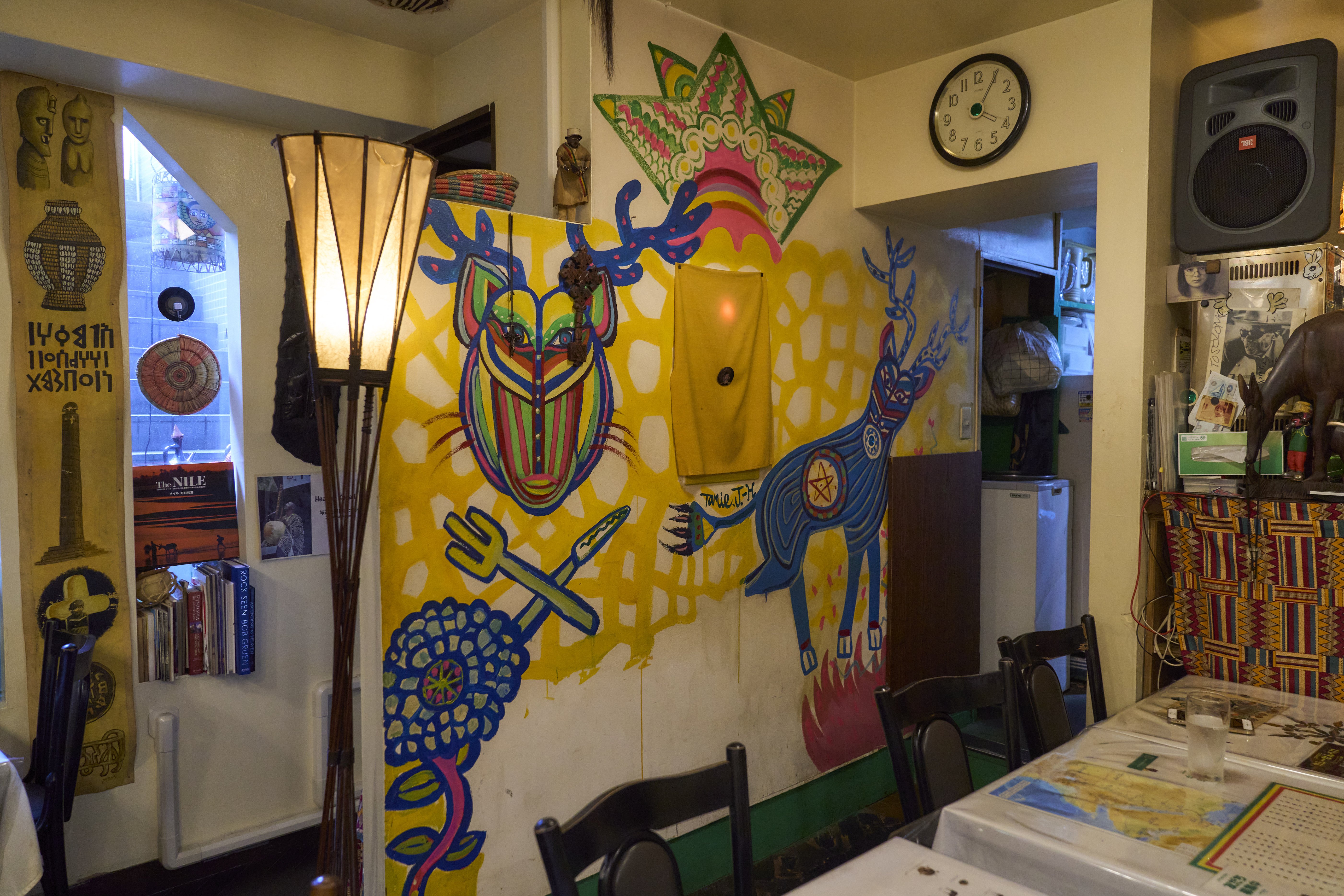 Colorful murals make customers feel like they are in Africa.