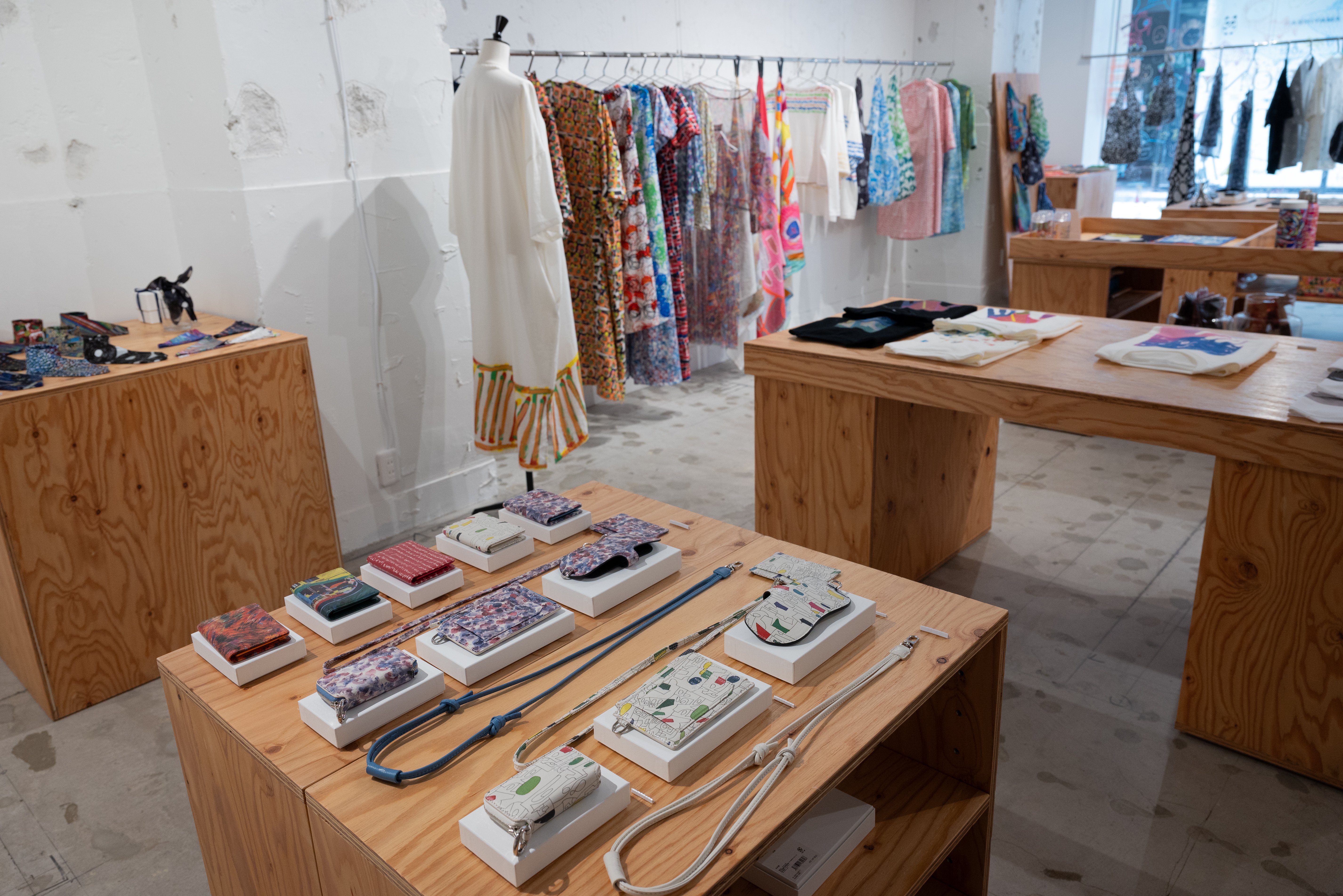 On the first floor, the shop offers art-inspired products that carry the creativity of HERALBONY artists into daily life.