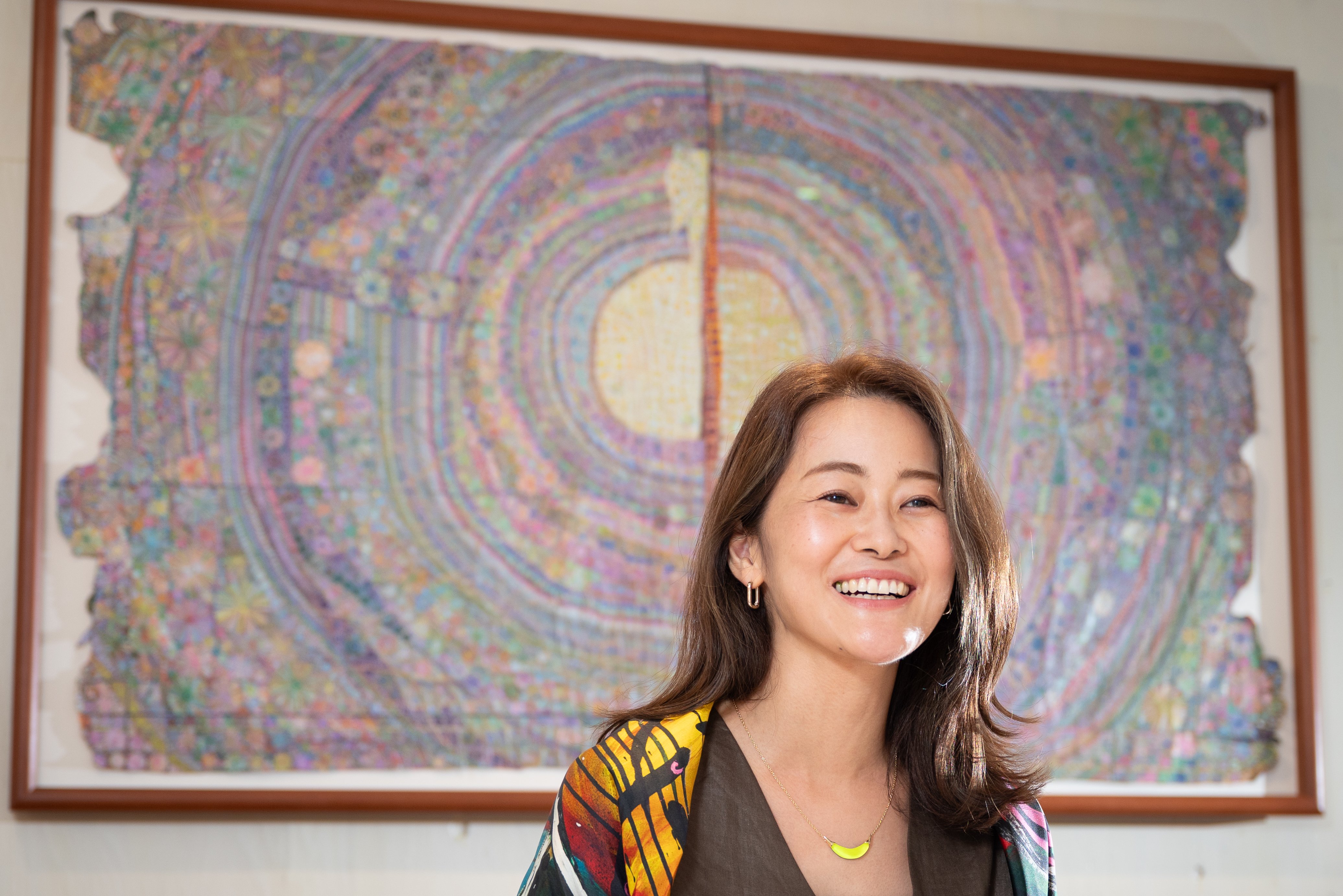 Oshioka, pictured with Hyoka (2024) by artist Asano Haruka, winner of the inaugural  HERALBONY Art Prize.