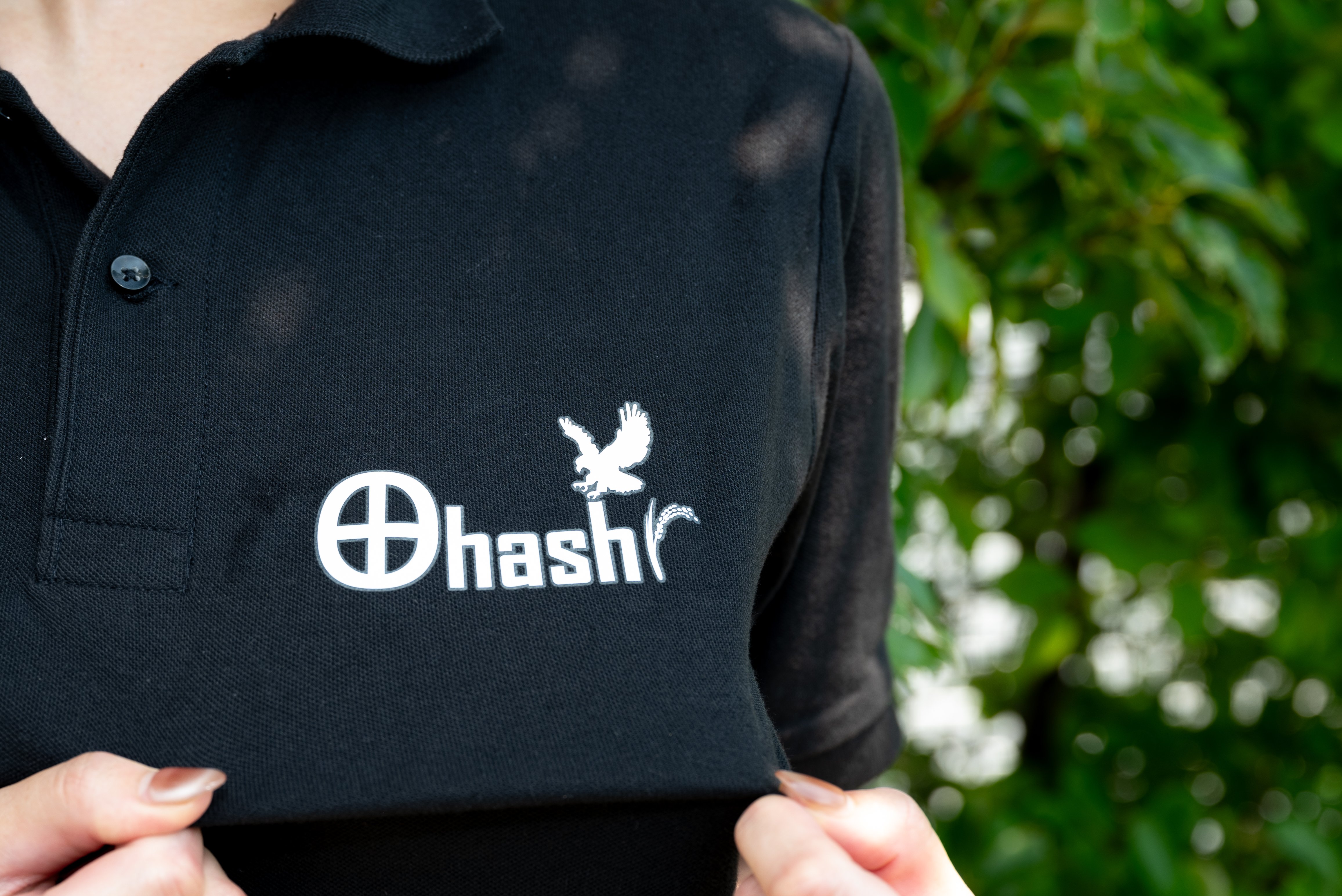 Staff uniform with northern goshawk and rice paddy motifs.