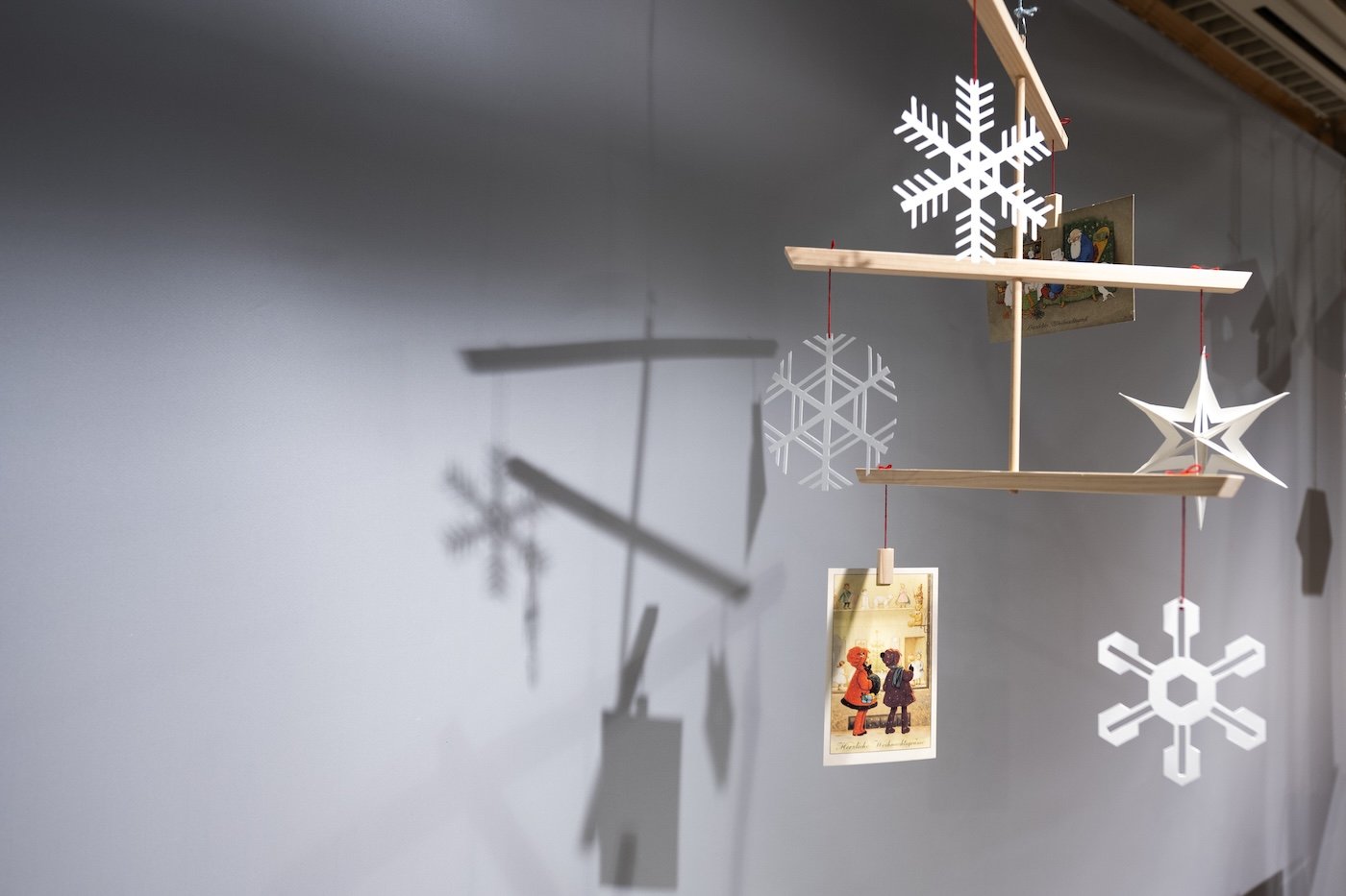 A winter-themed mobile made from wood.