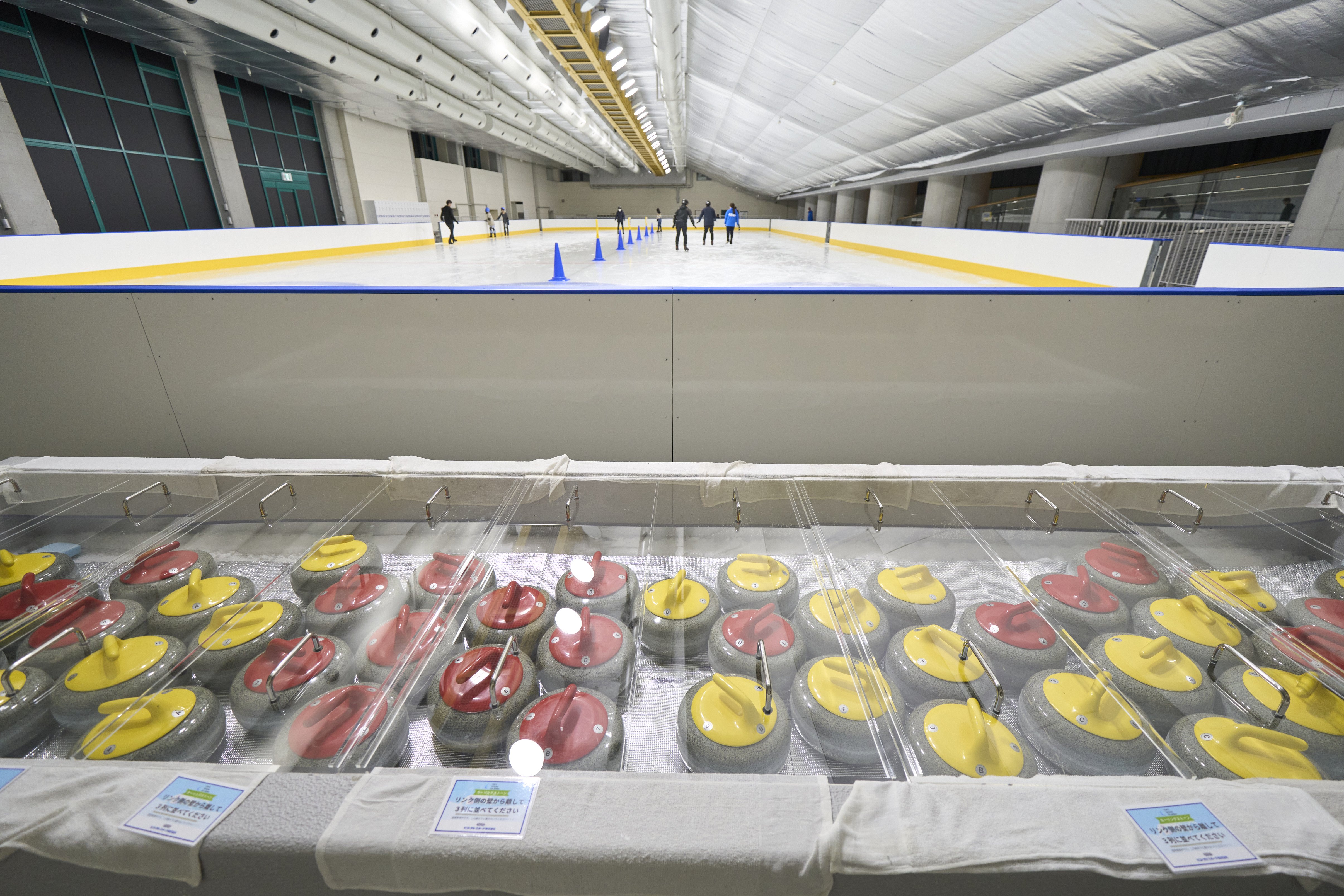 Curling stones are stored just behind the secondary rink.